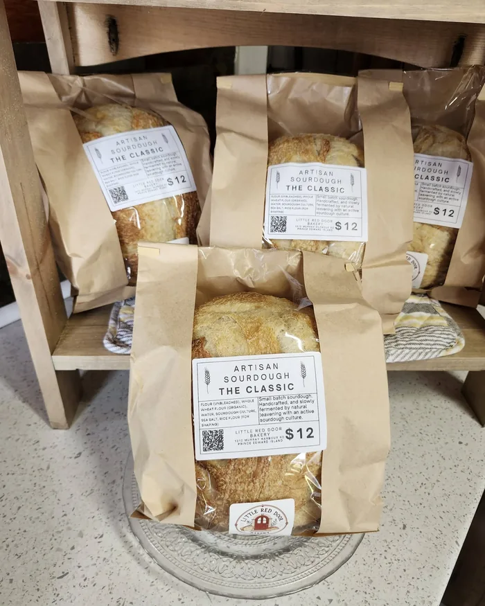 Bagged sourdough loaves on the farm store shelf, priced