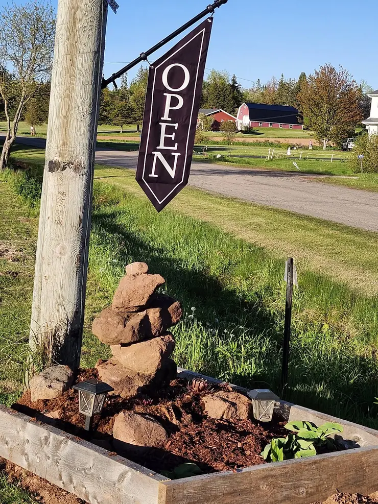 The roadside OPEN flag at the end of the driveway on Abney Road
