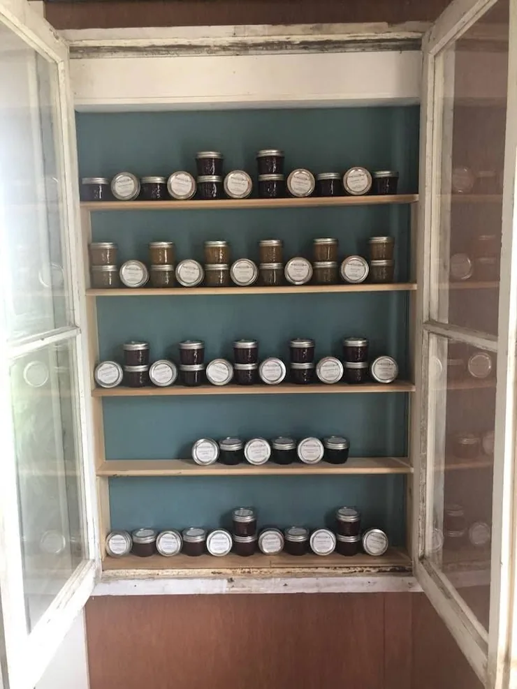 The preserve cabinet in the farm store, fully stocked